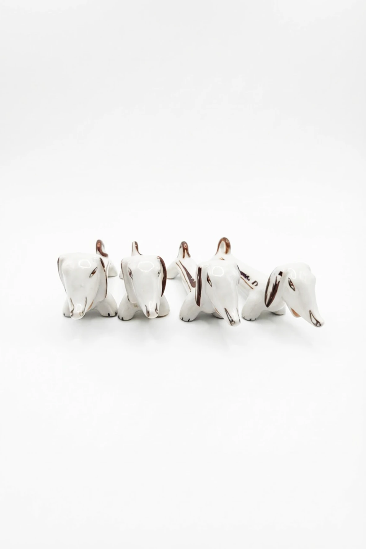 Lot de 4 porte-couteaux en porcelaine